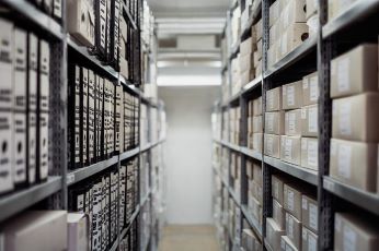 Shelves containing folders and records