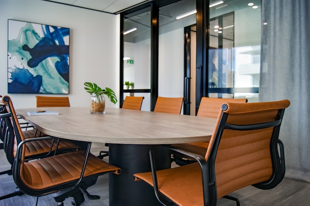 photo of an empty table and chairs in an office